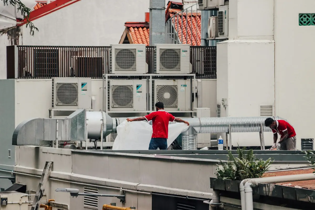 Miami HVAC technician servicing an outdoor air conditioning unit